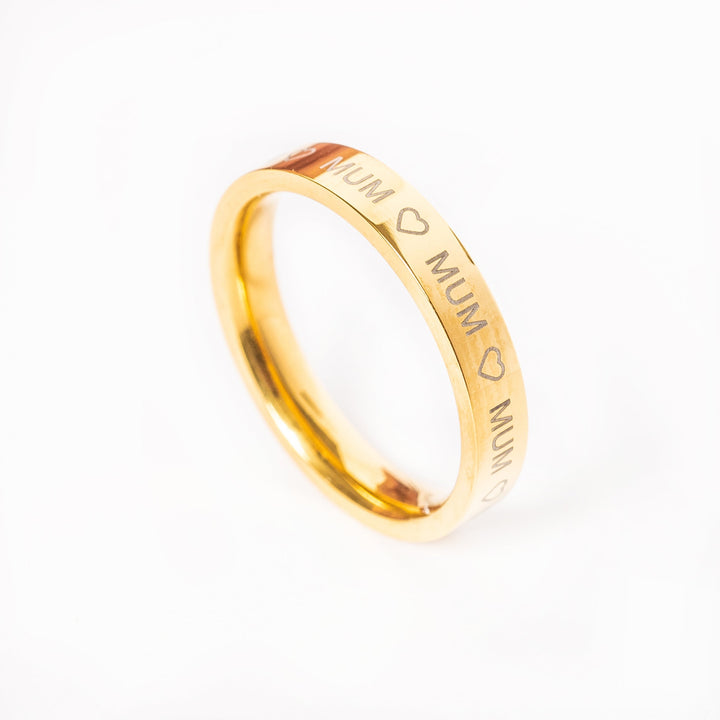 A gold-plated stainless steel Mum ring with the word 'MUM' and two hearts on it, indicating a gift for a mother.