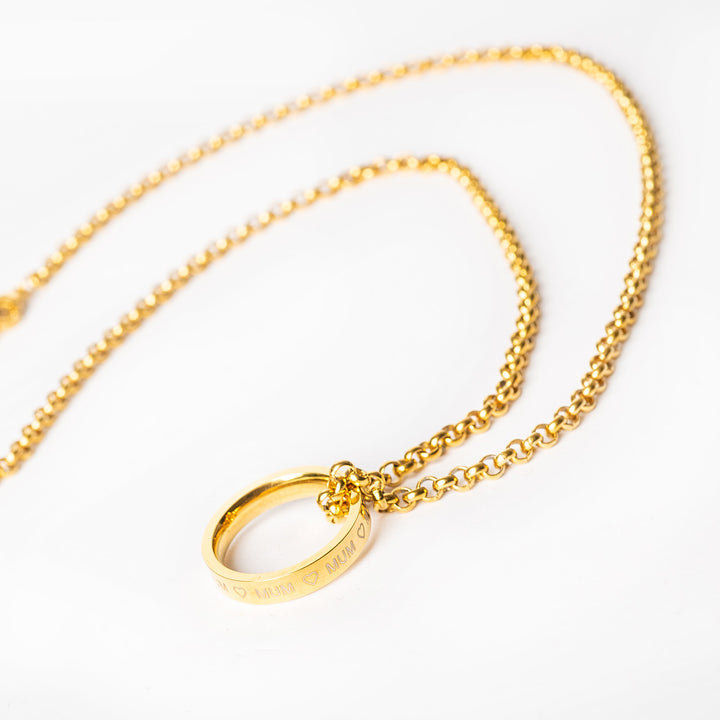 Close up view of mu ring necklace with mum ring pendant. 