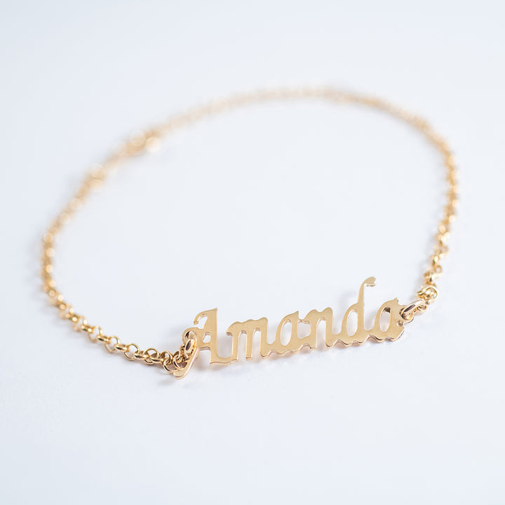 A bird view of Name Bracelet standing in the center of the image against a white background. 