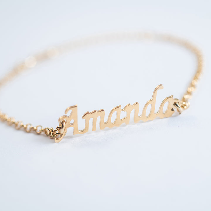Close up view of Name Bracelet with a blur white background. 