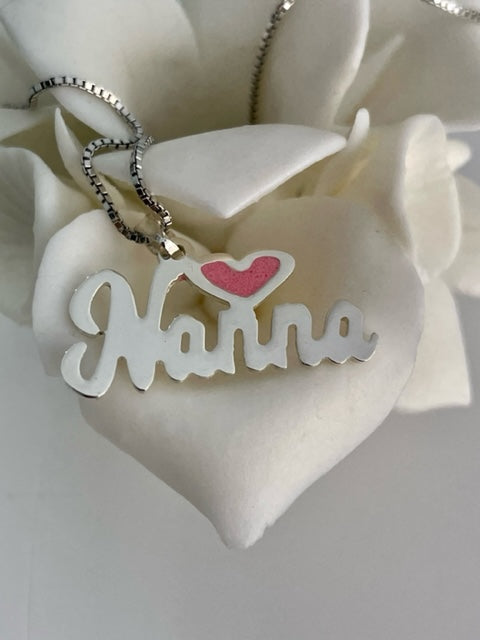 nanna pink heart necklace on a white rose. 