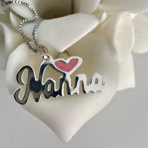 Nanna Pink Heart Neckalce standing on the beautiful roses petal. 
