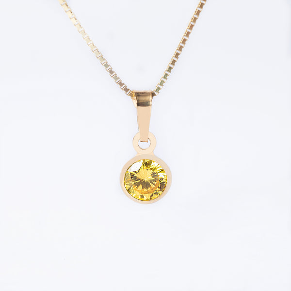 A yellow gold-plated silverNovember Birth Stone pendant with a citrine yellow gemstone in the center, attached to a gold-plated chain.
