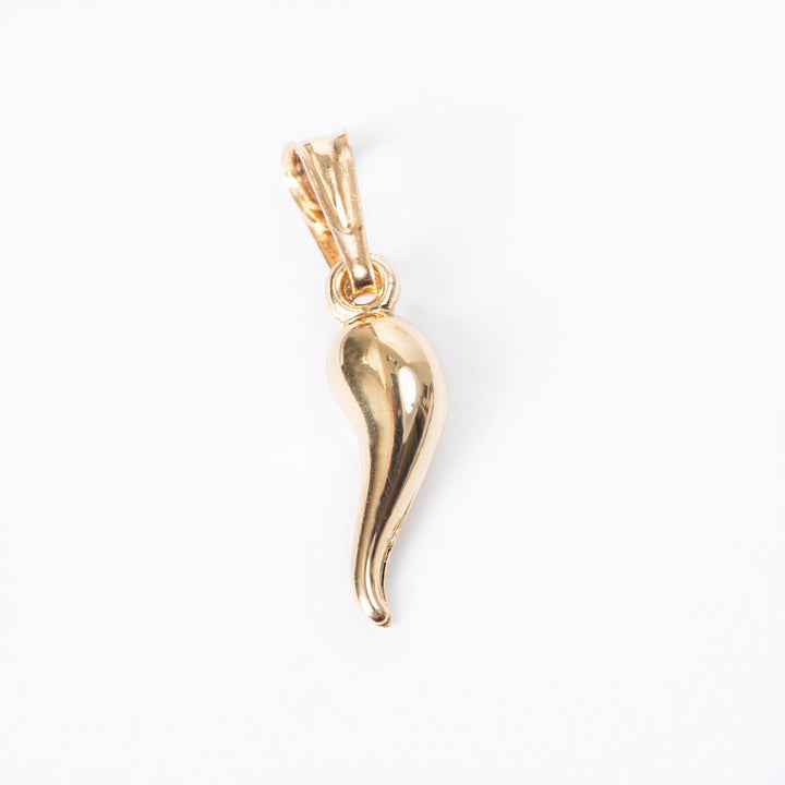 A close up view of Pepper Pendant standing in the center of the image against a white background. 