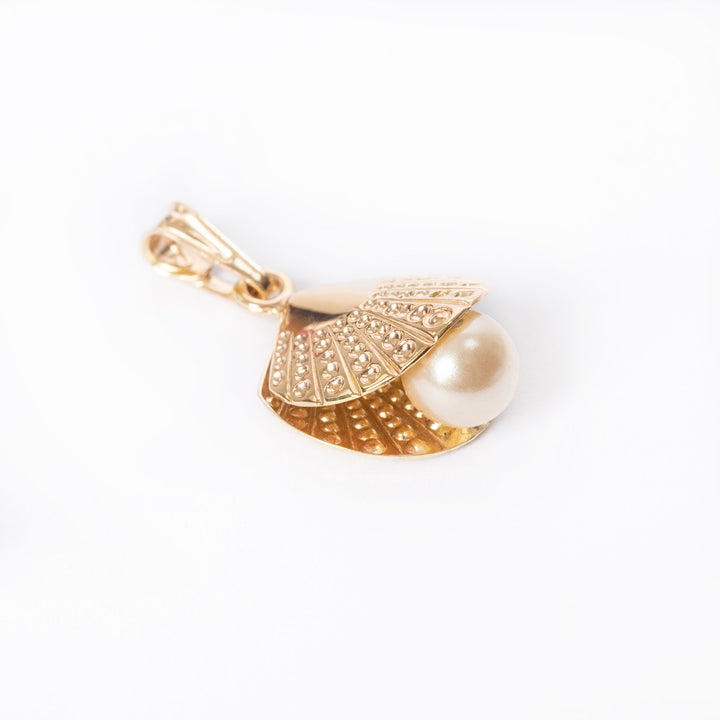 A profile view of Oyster Pearl Pendant standing in the center of the image against a white background. 
