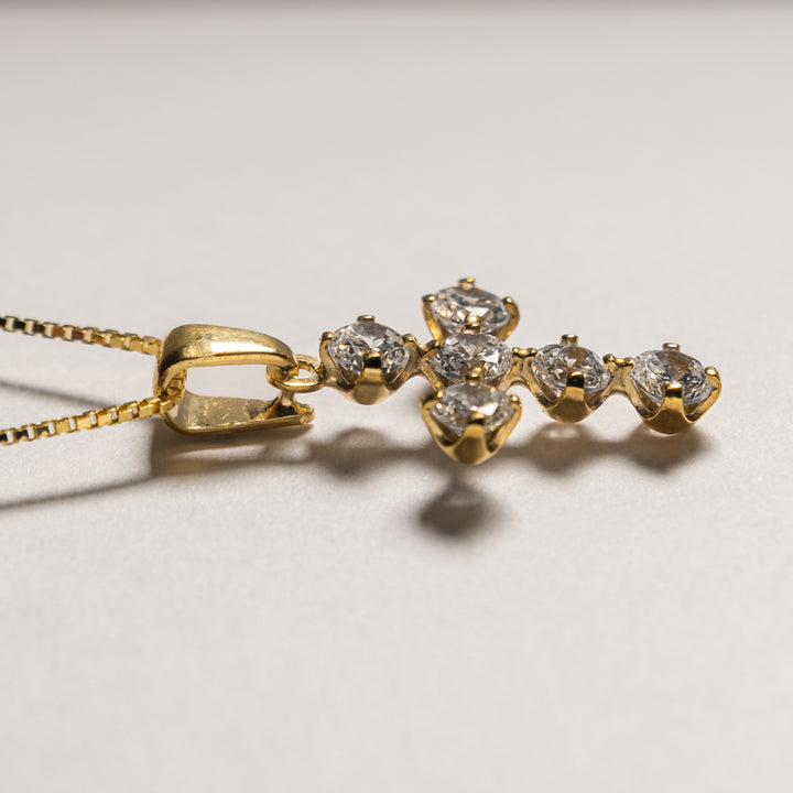A side view of White Zircons Cross Pendant