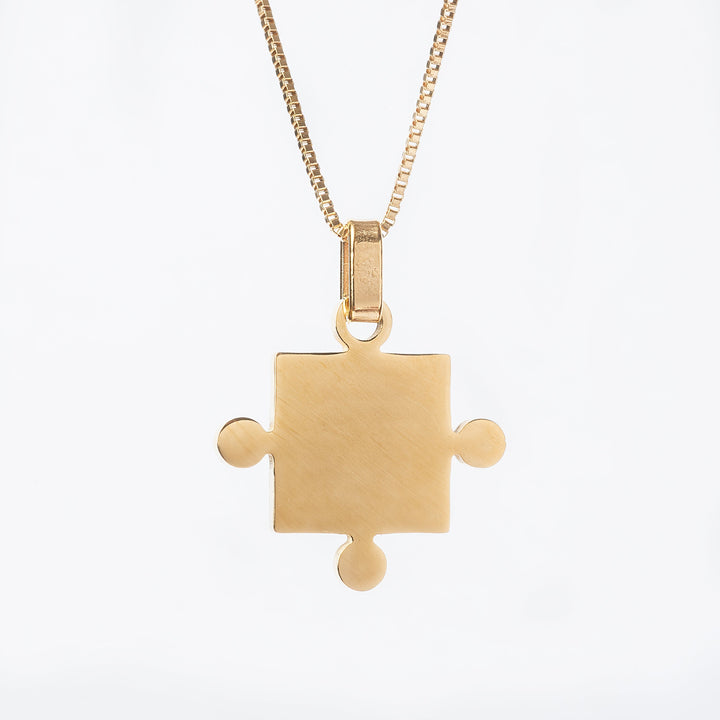 Two Puzzle Couple Necklace standing in the center of the image 