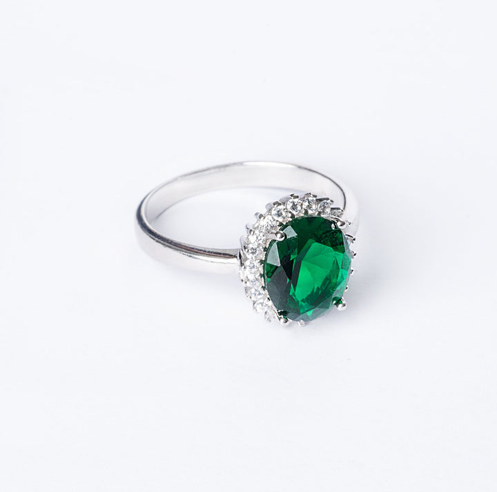 Kate Ring green stone colour standing in the center of the image. 