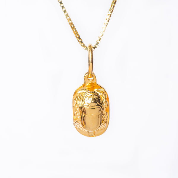 A close up view of Scarb necklace standing in the center of the image against a white background. 