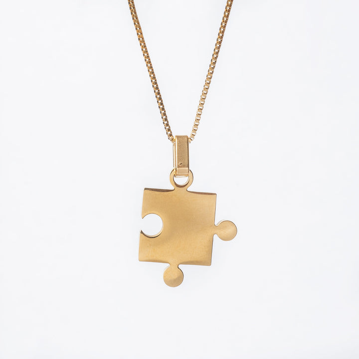 A close up view of single puzzle standing in the center of the image against a white background. 