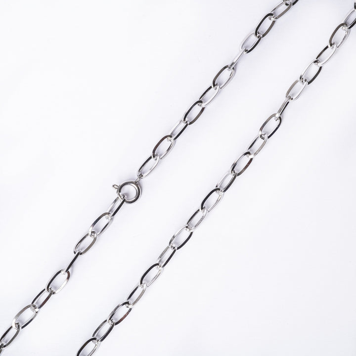 detailed close up view of stef necklace standing against a white background. 