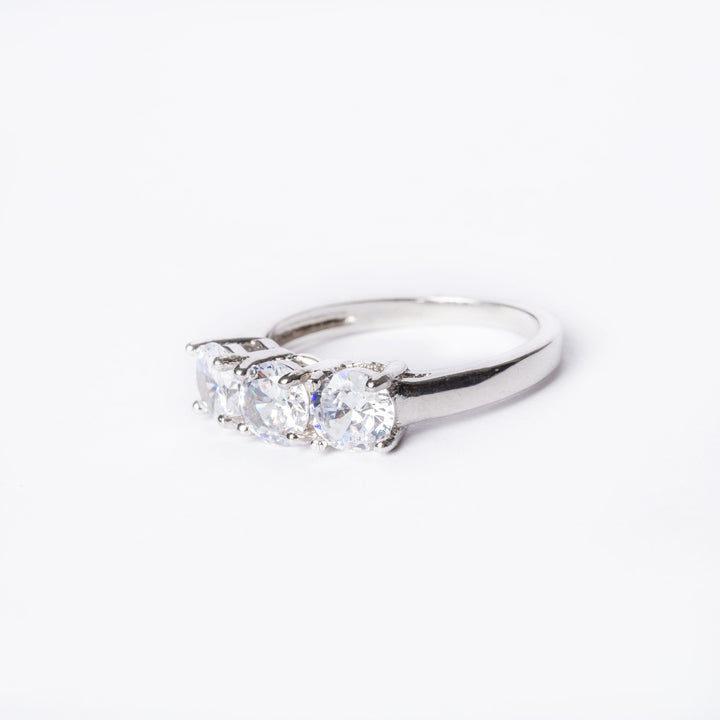 Trilogy Ring left side view, placed in the center of the image against a white background. 