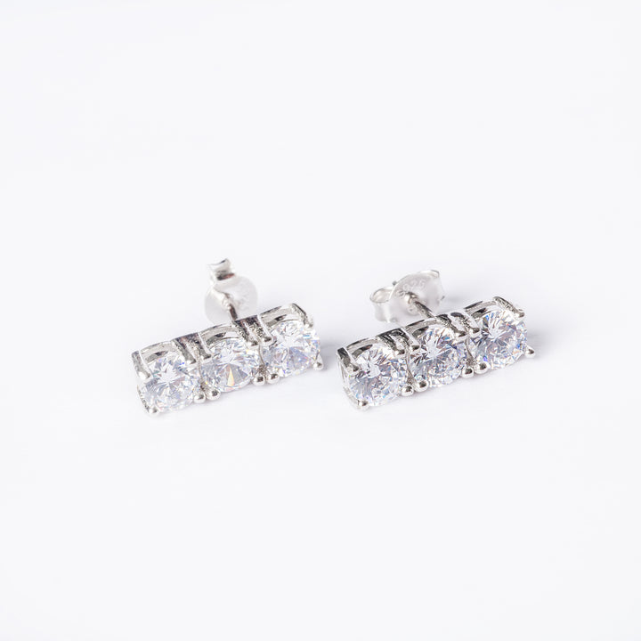 A front part view of Trilogy Earrings standing in the center of the image against a white background. 