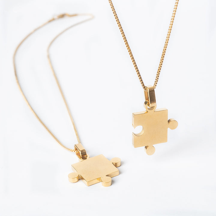 Two Puzzle Couple Necklace in the center of the image against a white background. 