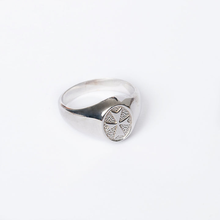 A close up view of Xandry silver ring standing in the center of the image against a white background. 